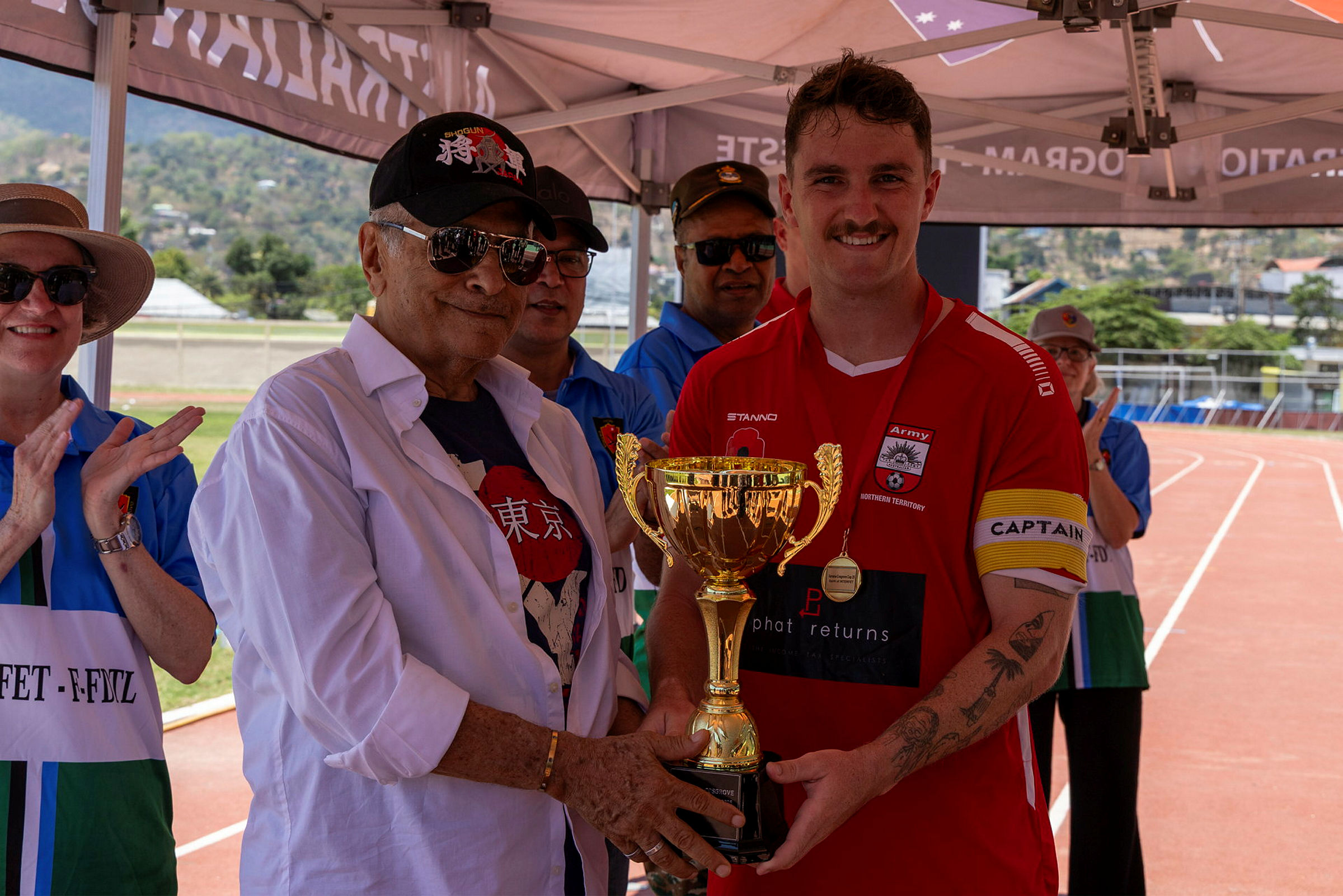 President of Timor Leste Dr Jose Ramos Horta Craftsman Dylan Mountain with the Xanana Cosgrove Shield Dili Timor Leste Indo Pacific Endeavour 25